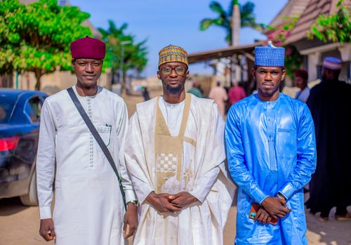 Free Three men in traditional African attire pose outdoors, showcasing cultural diversity and fashion. Stock Photo