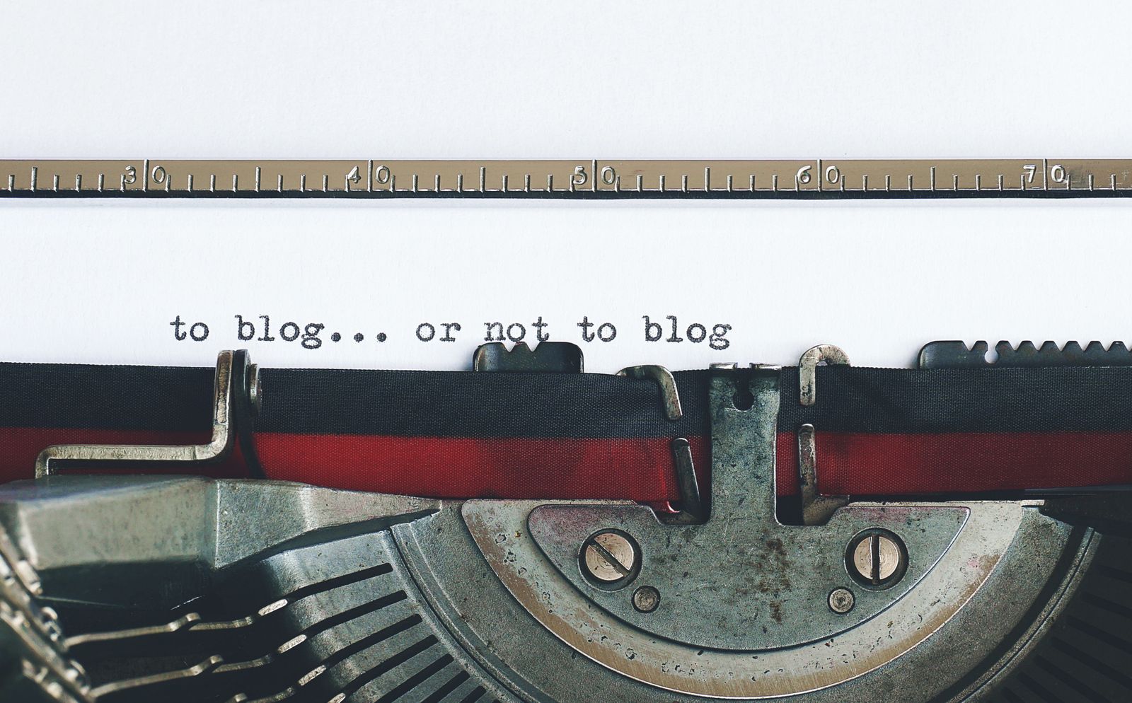Typewriter with a sheet of paper, representing the newsroom writing desk