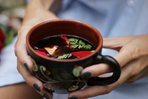 Person Holding a Teacup