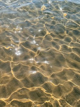 Rippling water with sparkling sunlight in the Mediterranean Sea.