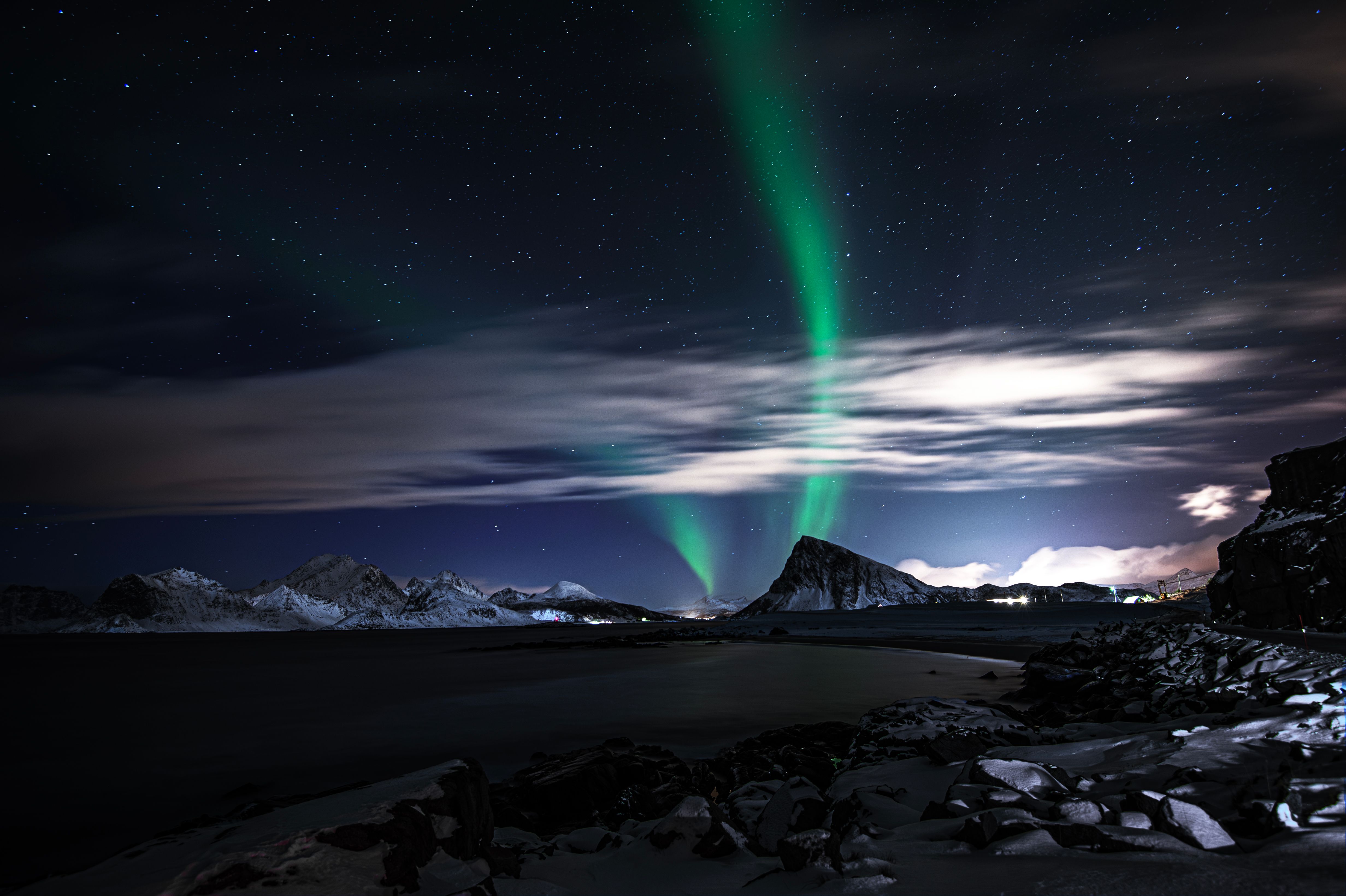 Stunning Aurora Borealis Over Snowy Mountains at Night · Free Stock Photo