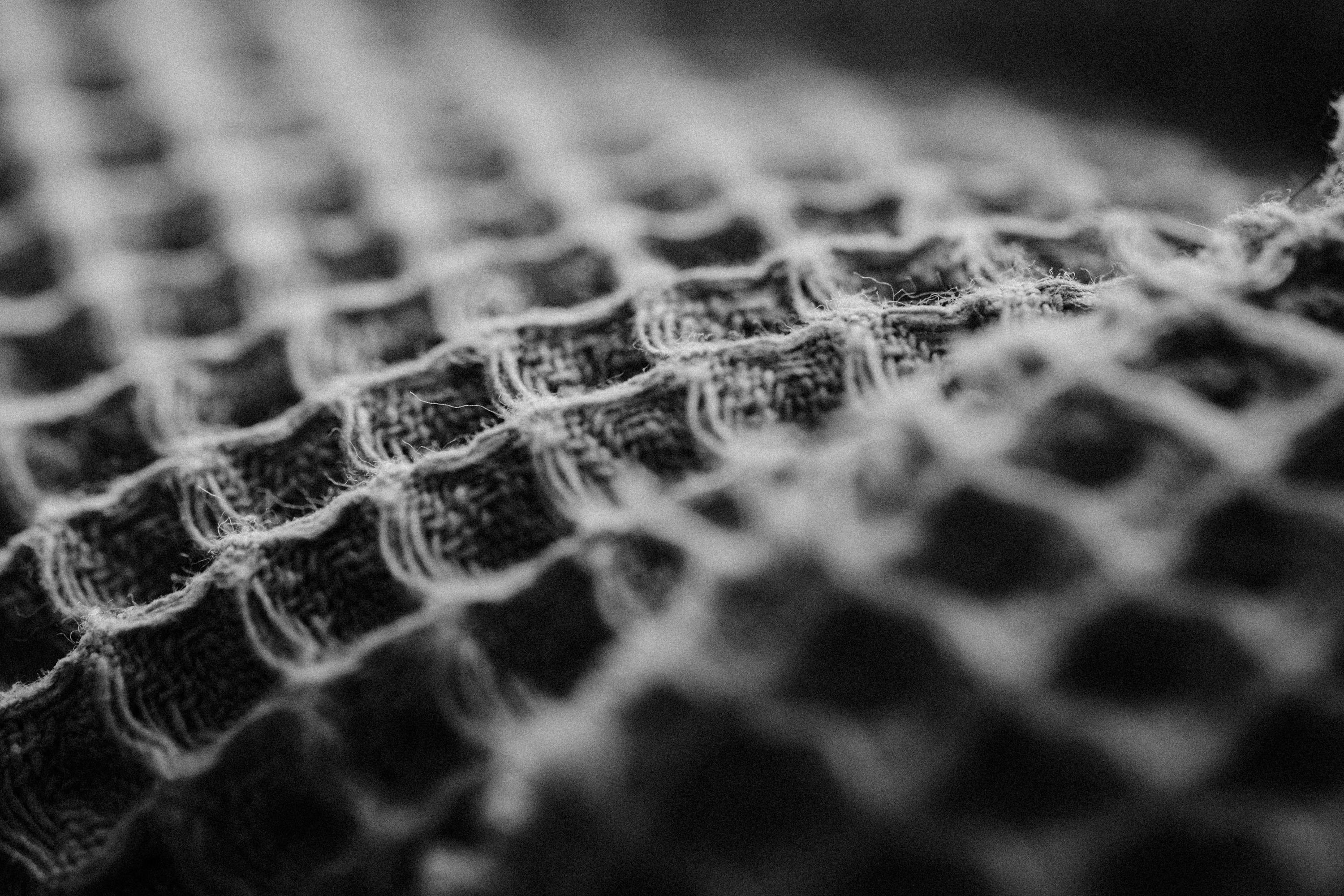 Free Detailed black and white close-up of a textured fabric weave pattern, artistic and abstract. Stock Photo