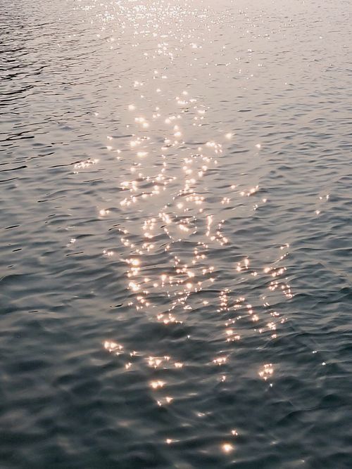 Free A serene view of sunlight reflecting on the water, captured in Jakarta, Indonesia. Stock Photo