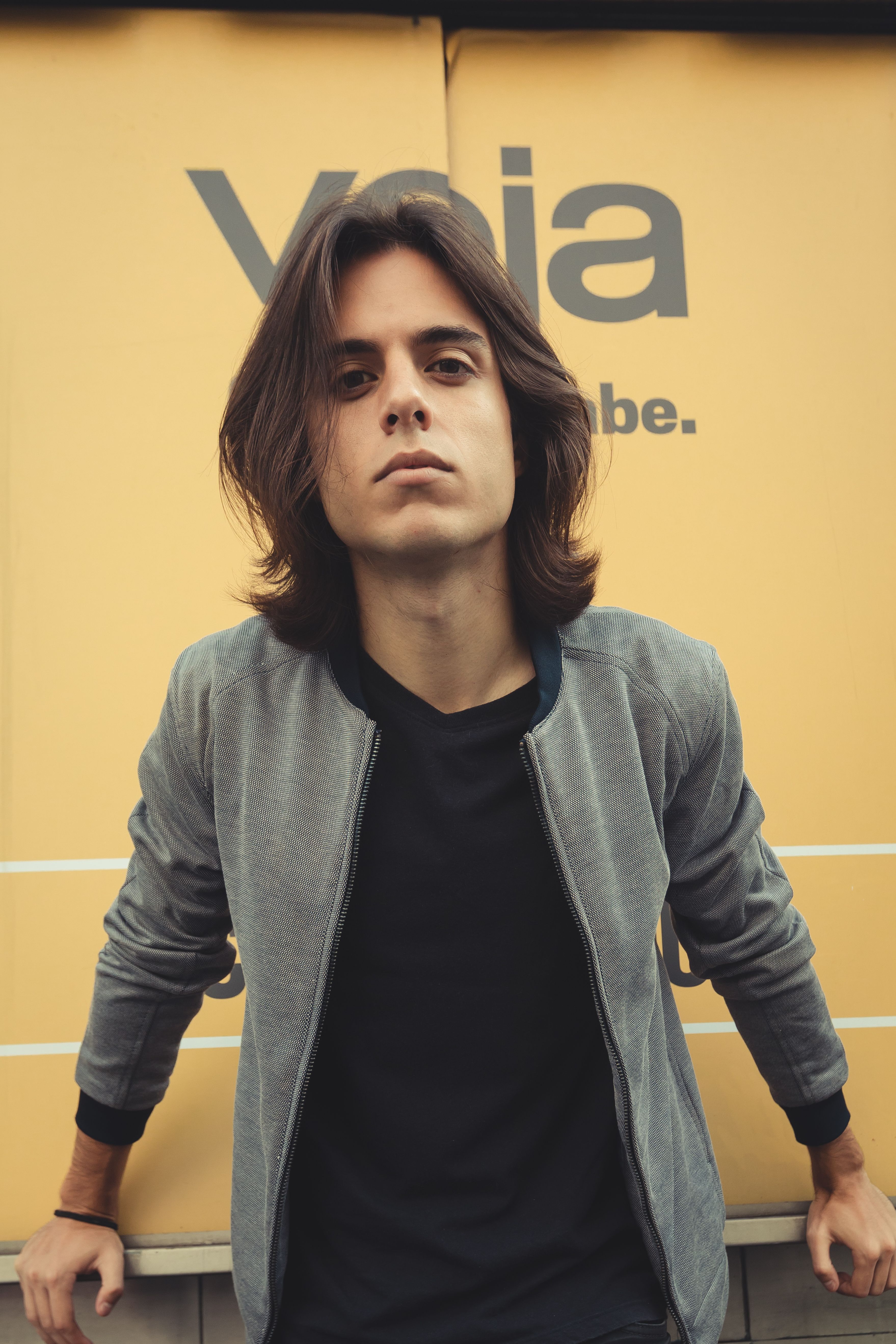 Captivating portrait of a young man in São Paulo with a modern urban feel.