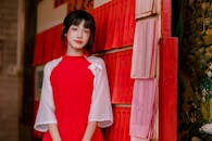 Young Woman in Traditional Red Dress Indoors