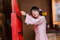 Young Woman in Traditional Dress at Temple