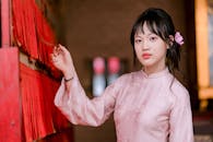 Young Woman in Traditional Pink Vietnamese Dress