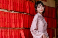 Young Woman in Traditional Dress with Red Scrolls