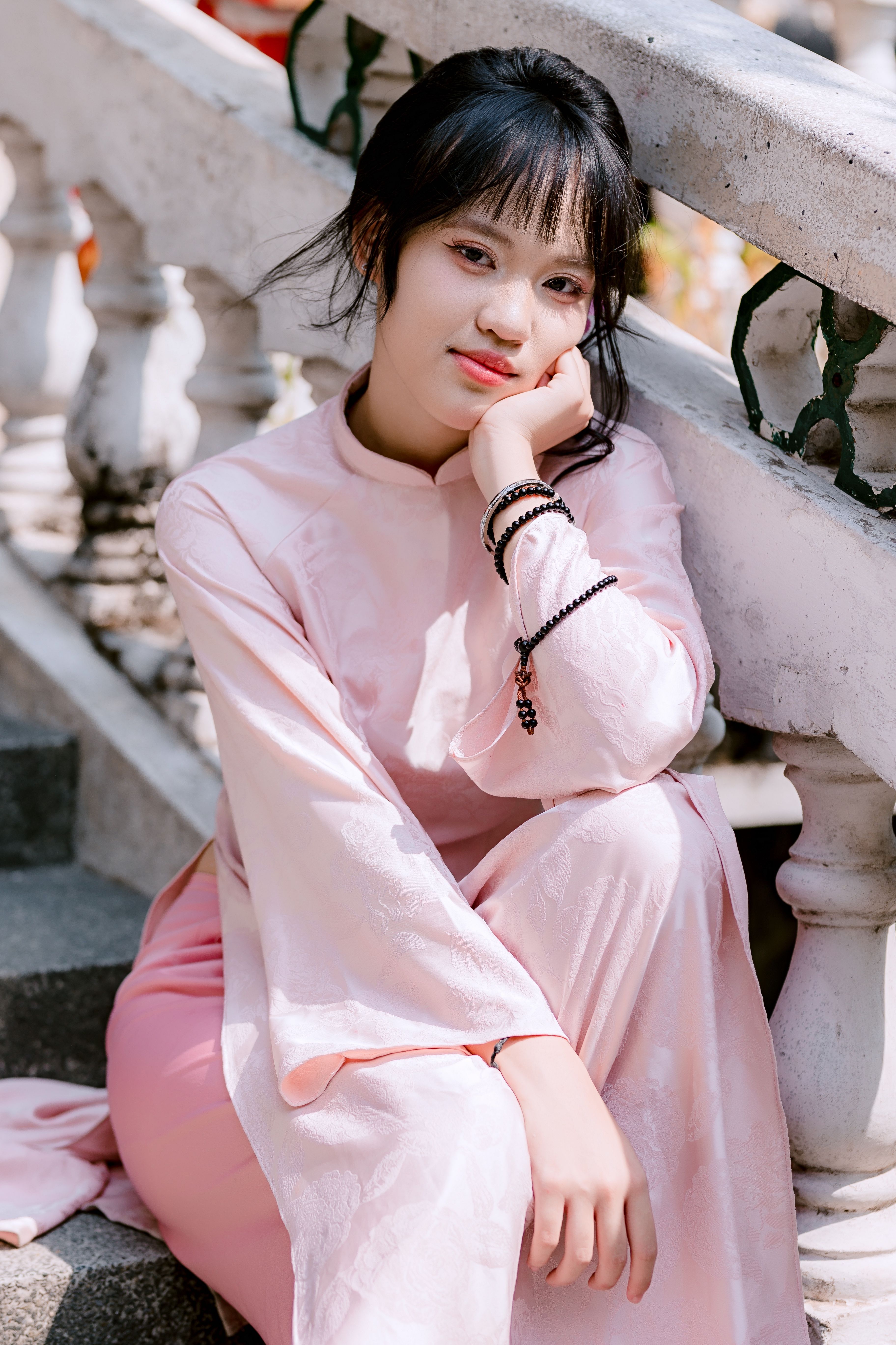 Elegant Woman in Traditional Pink Dress Portrait · Free Stock Photo
