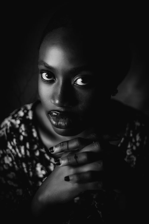 Free Dramatic black and white portrait of a woman with a captivating gaze. Stock Photo