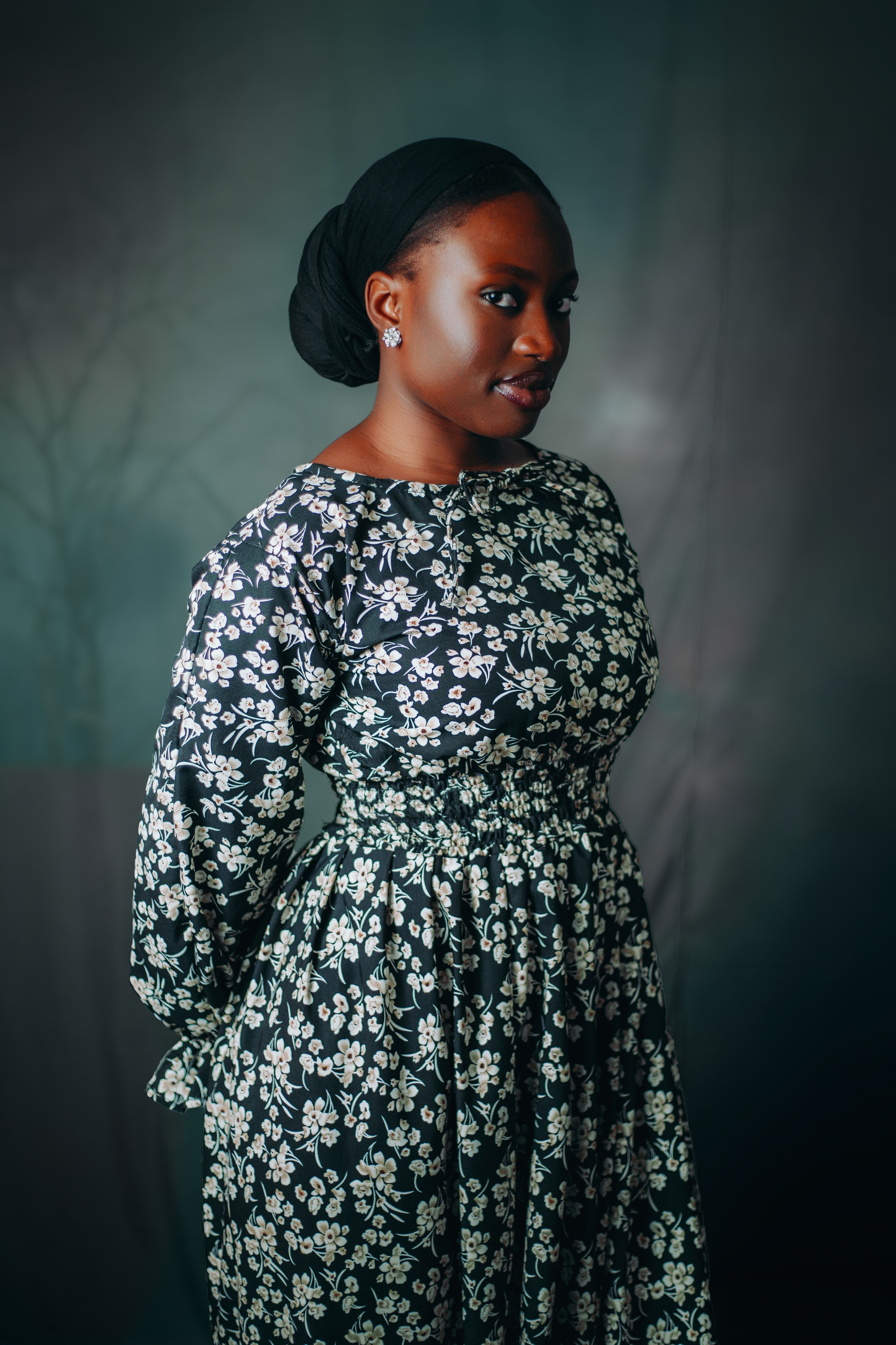 Elegant Woman in Floral Dress Portrait · Free Stock Photo
