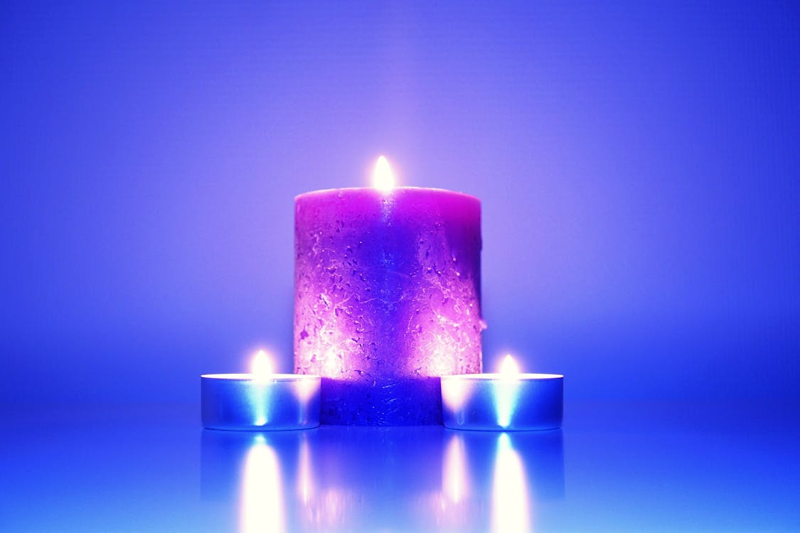 Free Three Lighted Candles Stock Photo