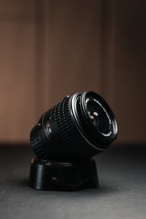 Free Black Camera Lens on Brown Wooden Table Stock Photo