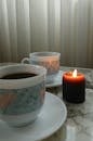 Cozy Coffee Cups and Candlelit Ambiance