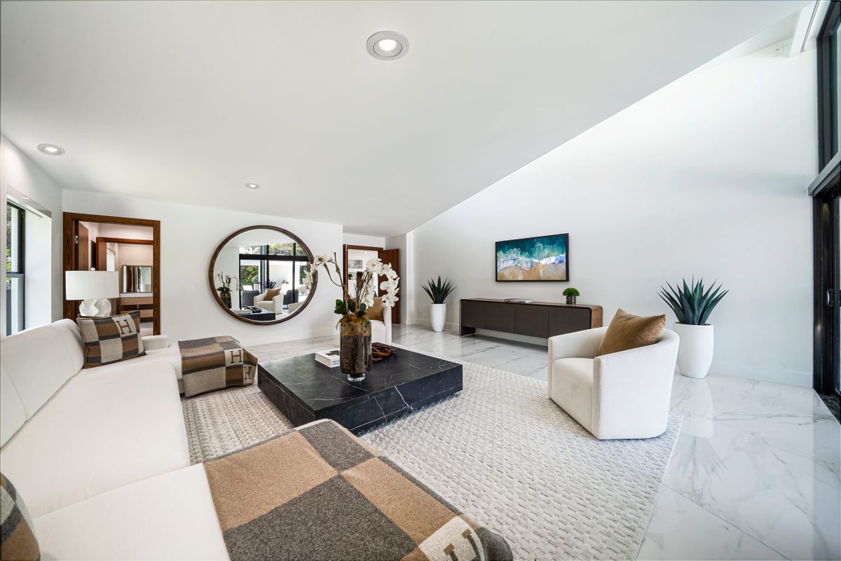 Elegant living room with large mirror and neutral decor