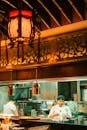 Chefs Cooking in a Modern Asian Restaurant Kitchen