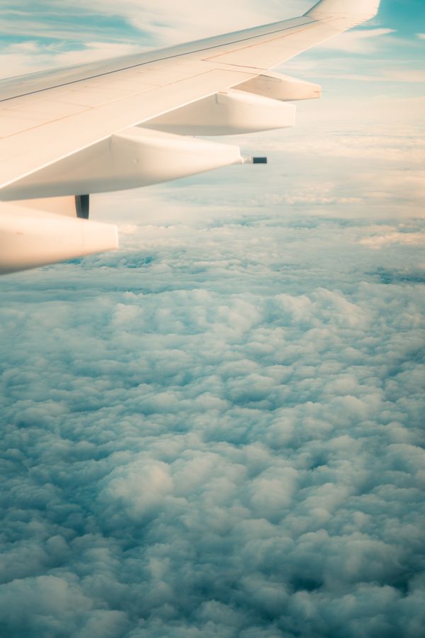 Airplane Wing over White Clouds · Free Stock Photo