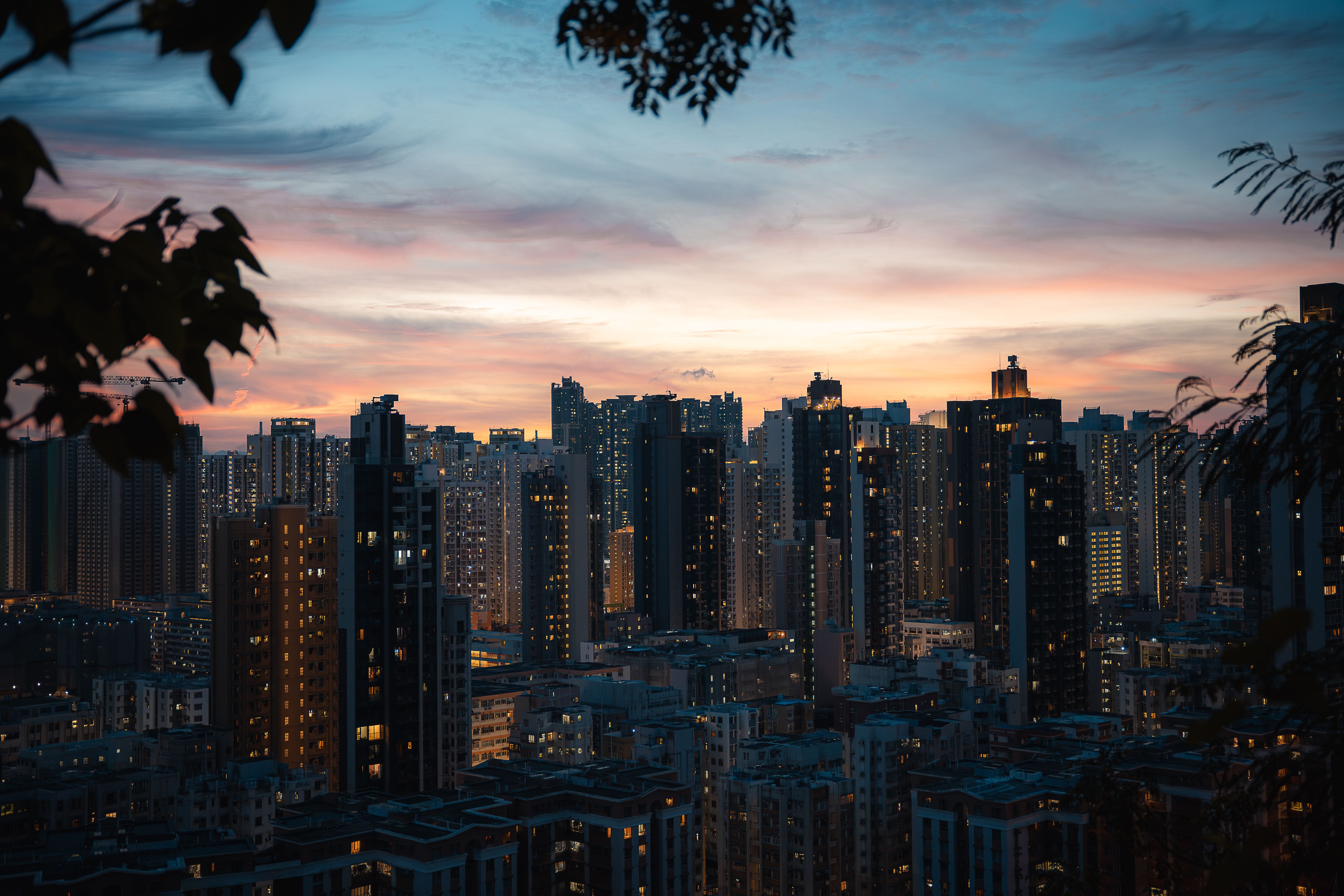 Hong Kong Skyline at Dusk with Vibrant Sunset · Free Stock Photo