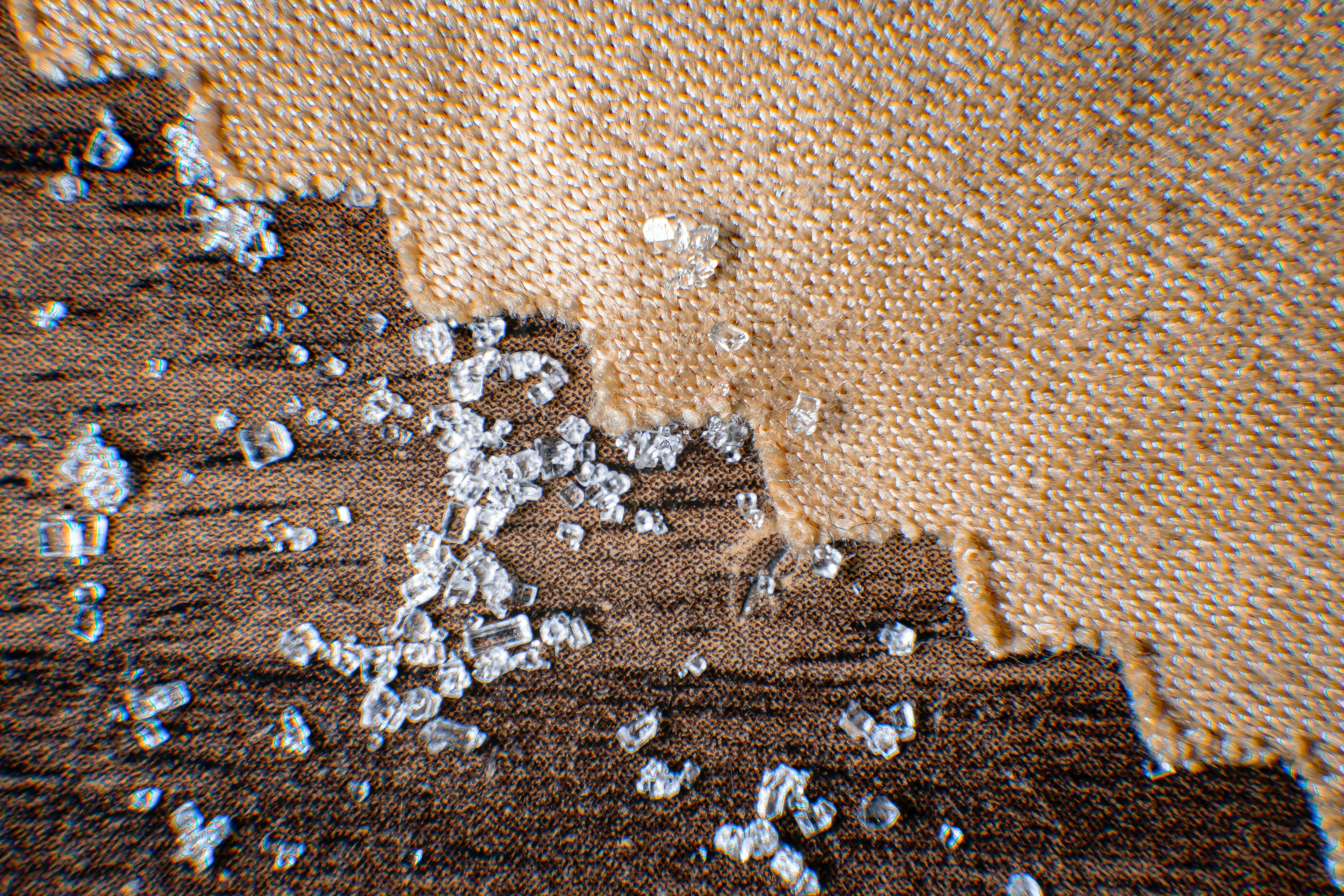 shingle granules in a gutter - roof damage repair near me