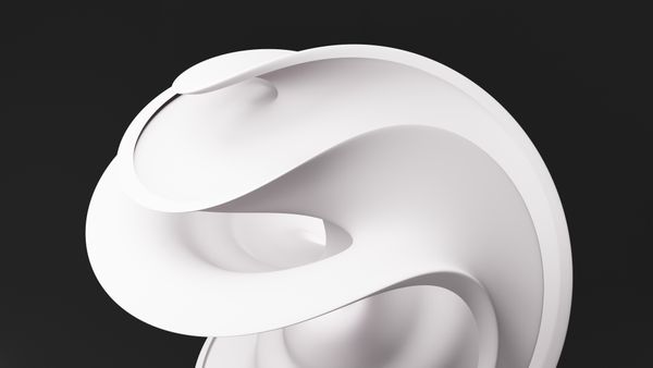 Minimal white sculptural form on a dark backdrop, photo by Mahmoud Ramadan on Pexels