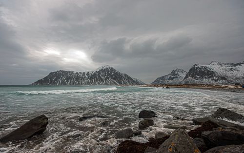 Free Capture the rugged beauty of winter in Nordland, Norway's scenic coastline with snow-capped mountains. Stock Photo