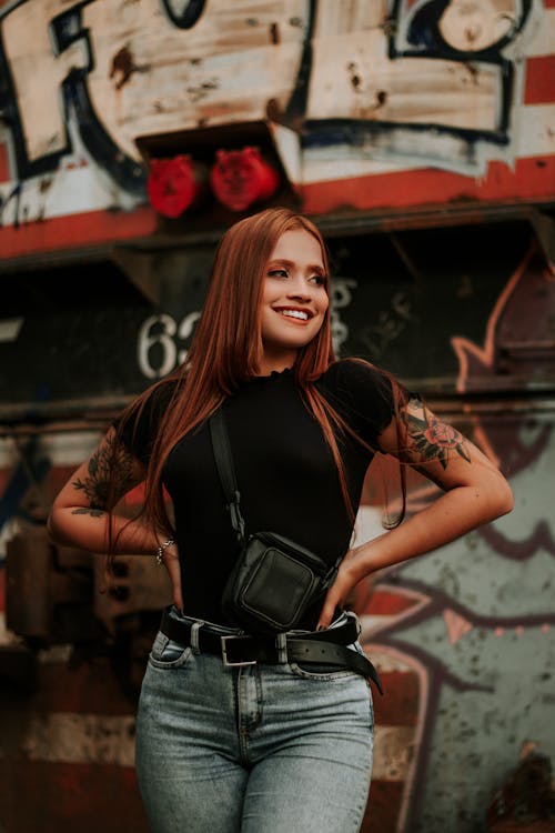 Free Woman in Black Top and Black Leather Shoulder Bag Stock Photo