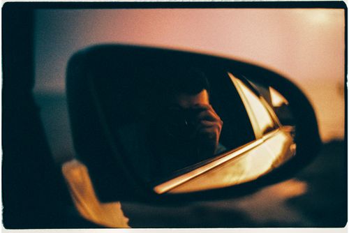 Portrait In Rear View Mirror Person Taking a Self Portrait on a Rear View Mirror · Free Stock Photo