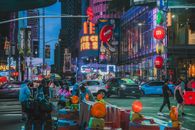 Lively evening in Times Square with neon lights, crowds, and iconic advertisements.