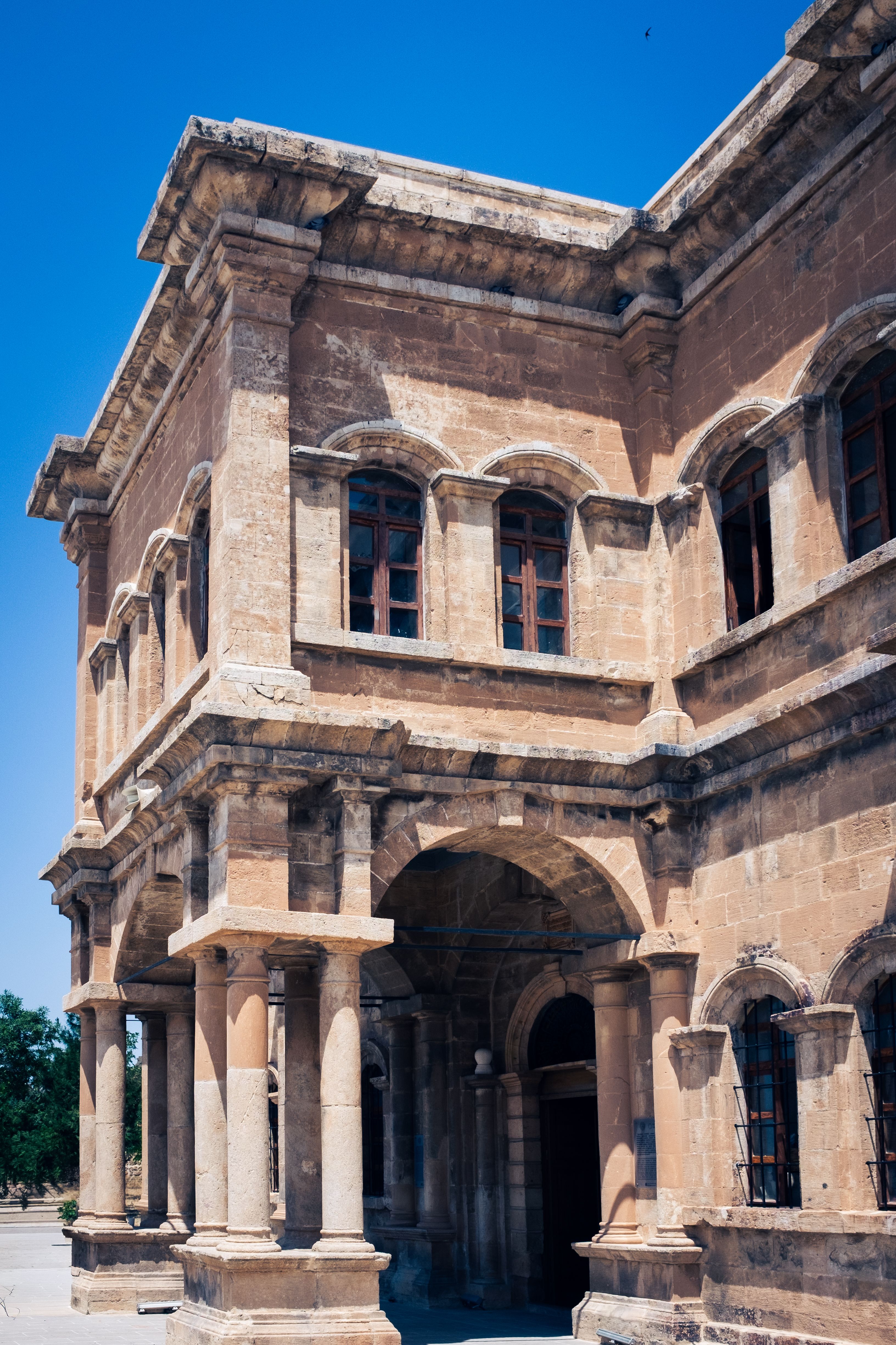 Historic Stone Building under Blue Sky · Free Stock Photo