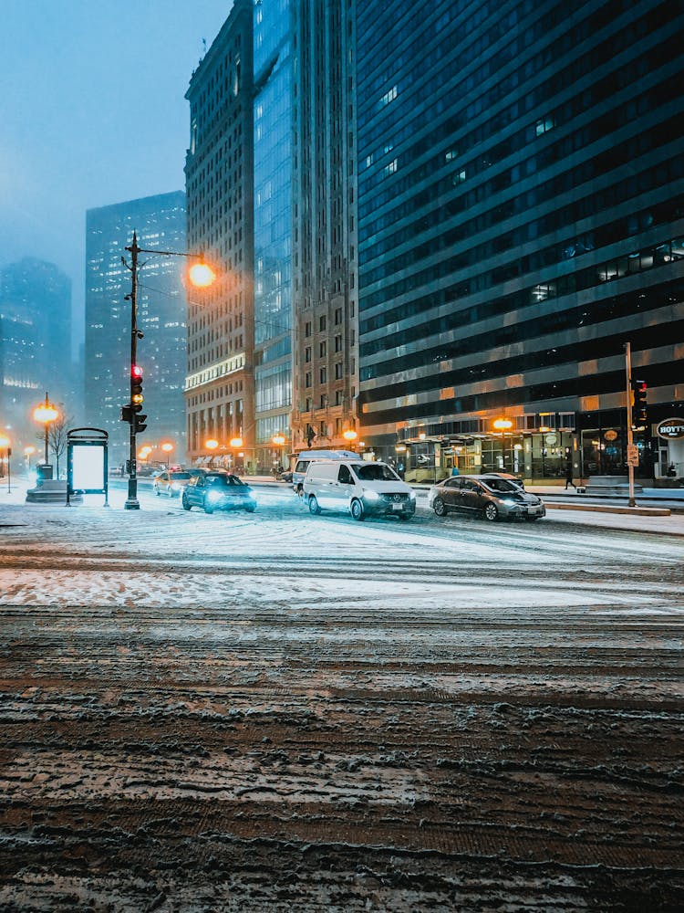 Cars On The Road With Snow During Night Time