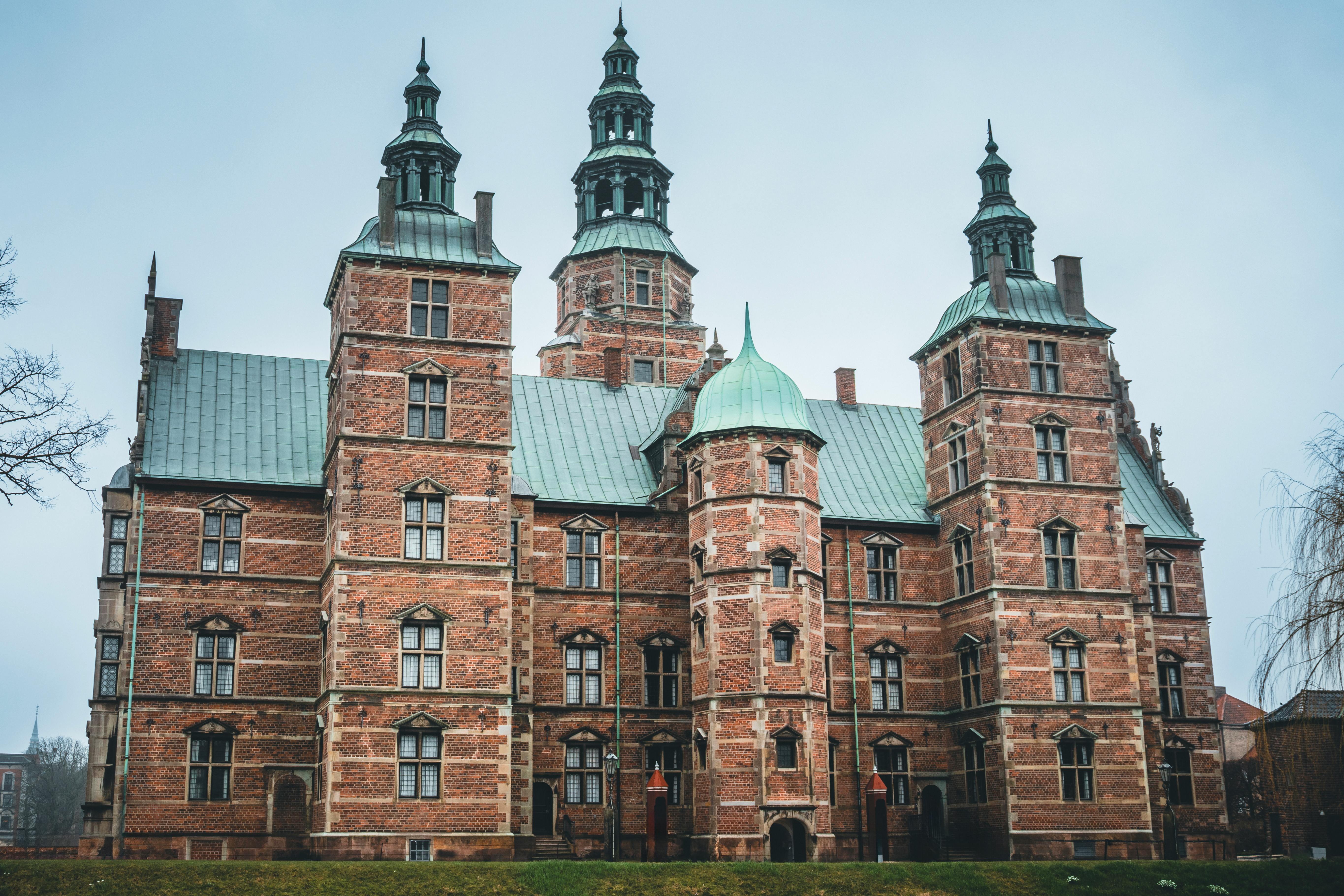 Explore the intricate architecture of Rosenborg Castle in Copenhagen, Denmark, captured on an overcast day.