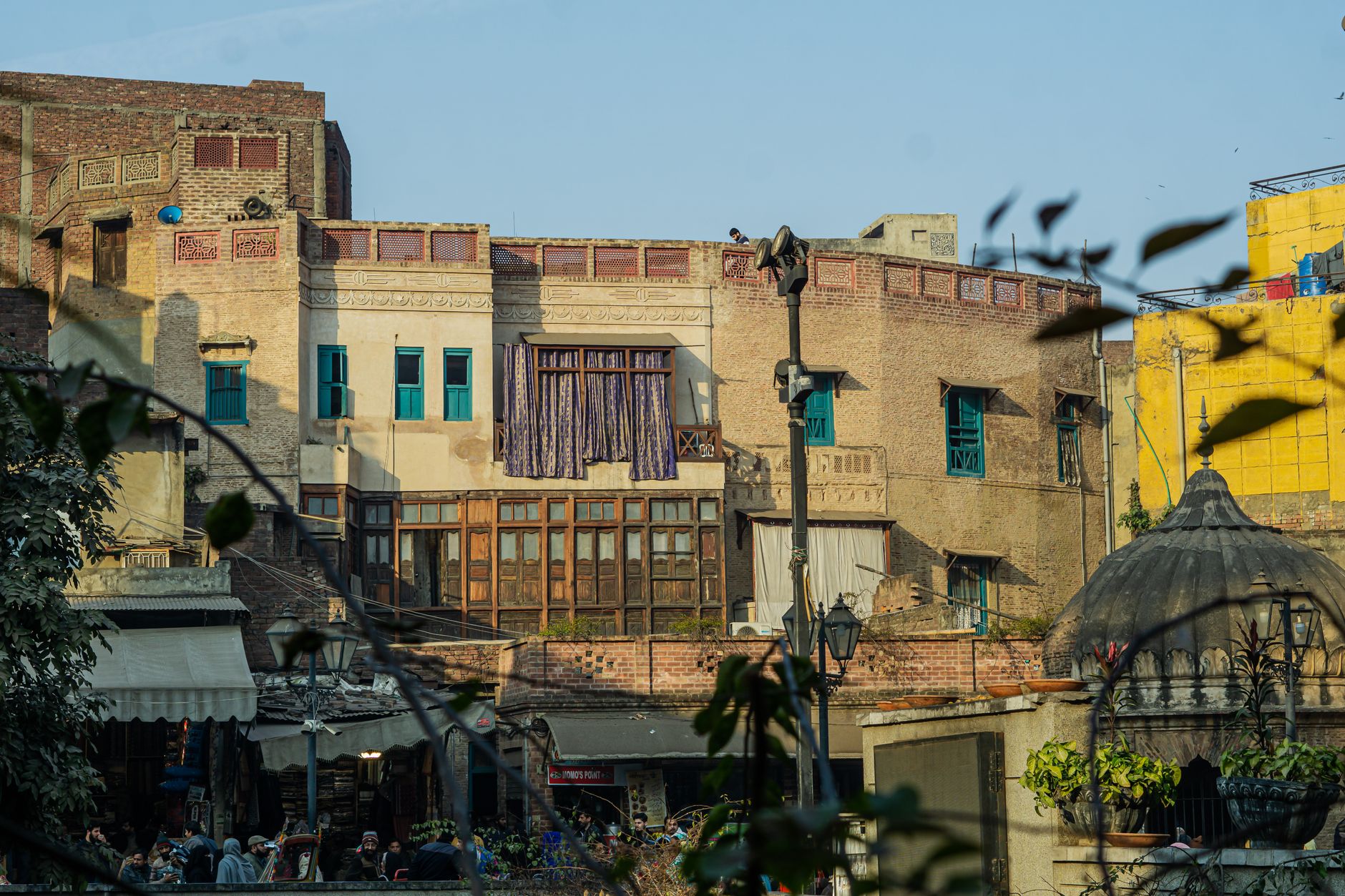Captivating shot of historic buildings with vibrant market activity, showcasing old-world architectural details.