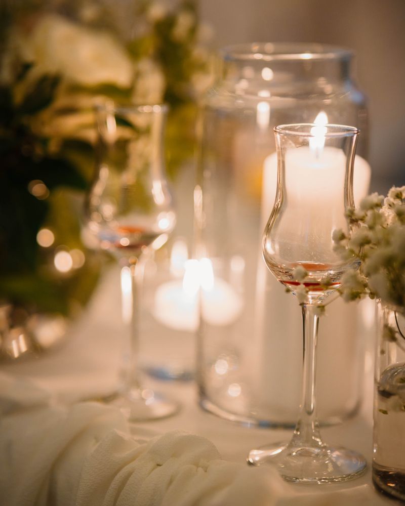 Private dinner party with candlelit table and floral arrangements
