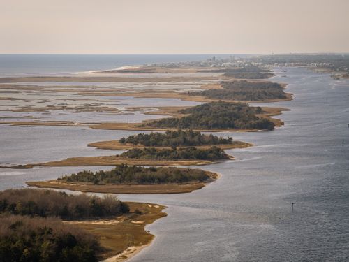 Free Breathtaking aerial view of the serene Carolina coastline with lush islands and calm waters. Stock Photo
