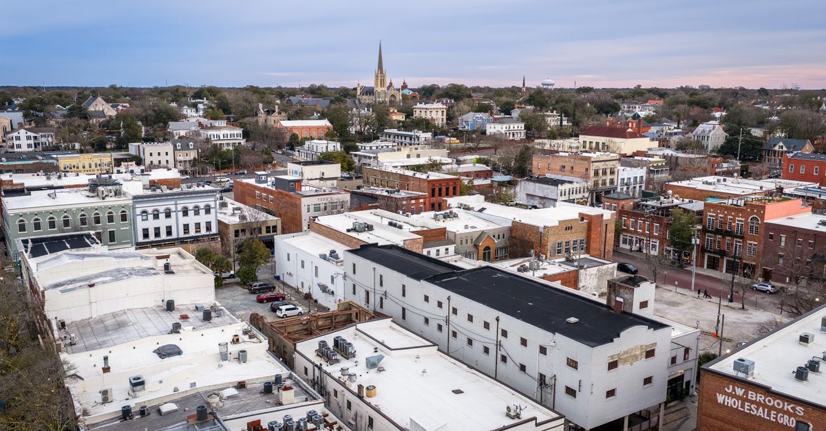 Aerial view of historic downtown Wilmington, NC showcasing urban architecture and church spires.
