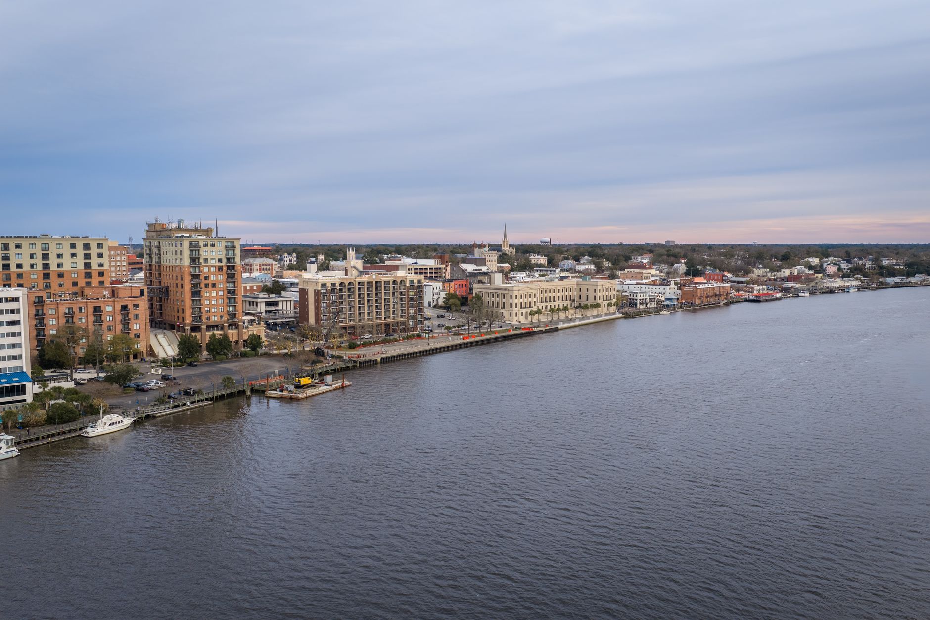 Aerial photo of Wilmington's vibrant riverfront with buildings and waterfront view.