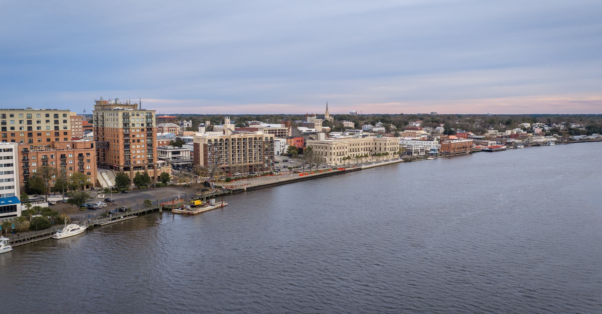 Aerial photo of Wilmington's vibrant riverfront with buildings and waterfront view.