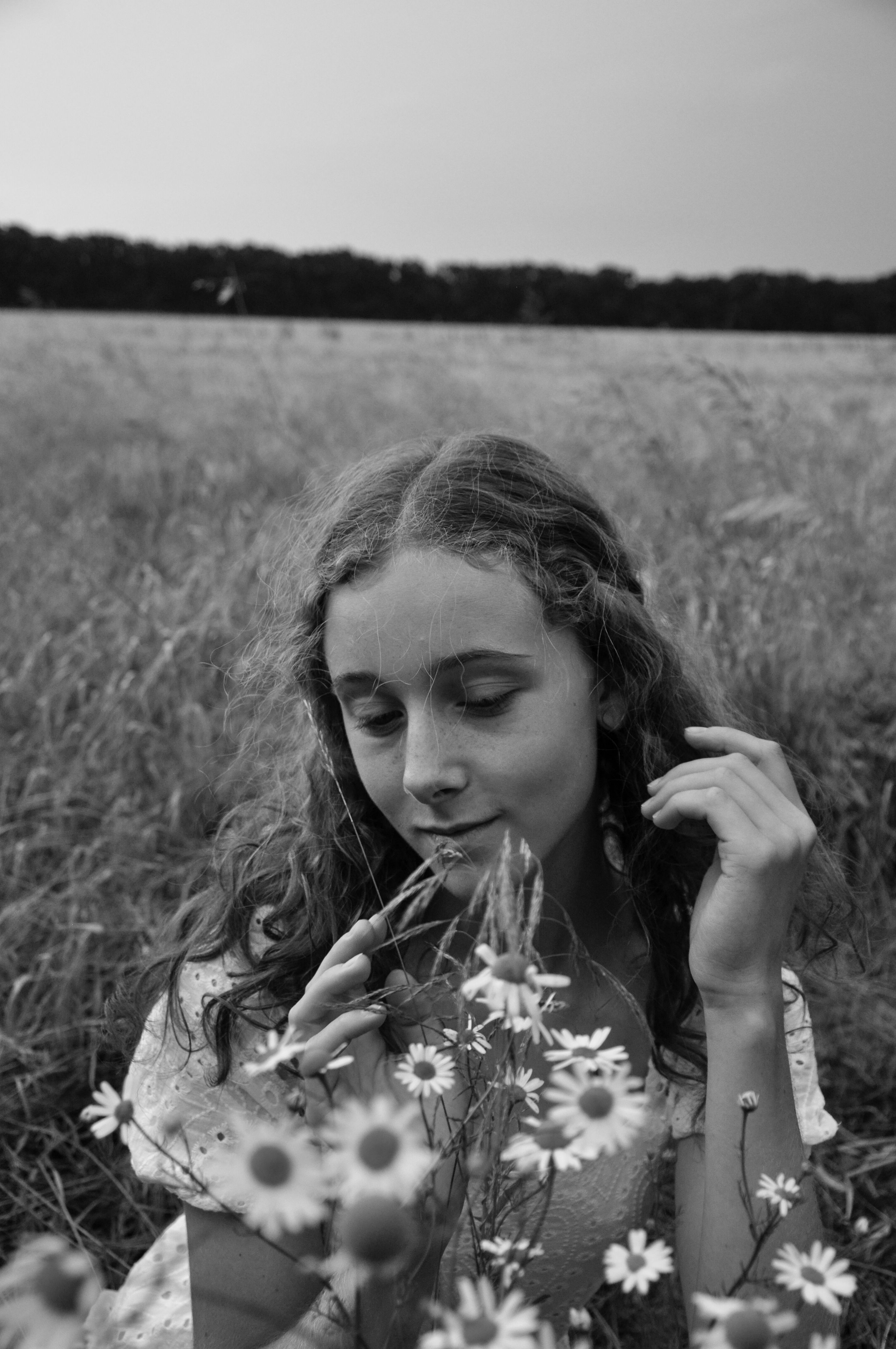 Black and White Portrait in a Field with Flowers · Free Stock Photo