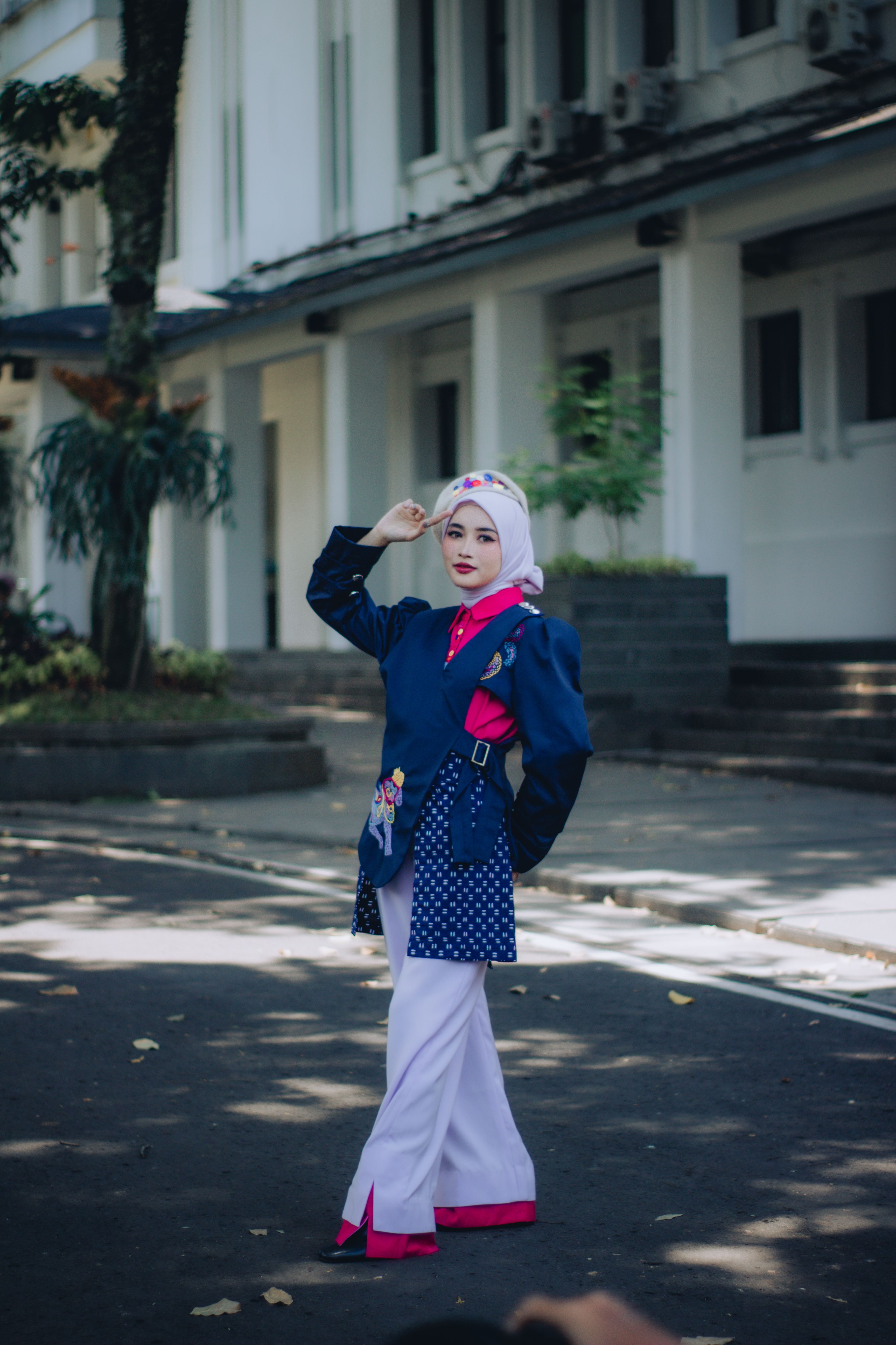 A vibrant cosplay outfit modeled outdoors in Jawa Barat, Indonesia.