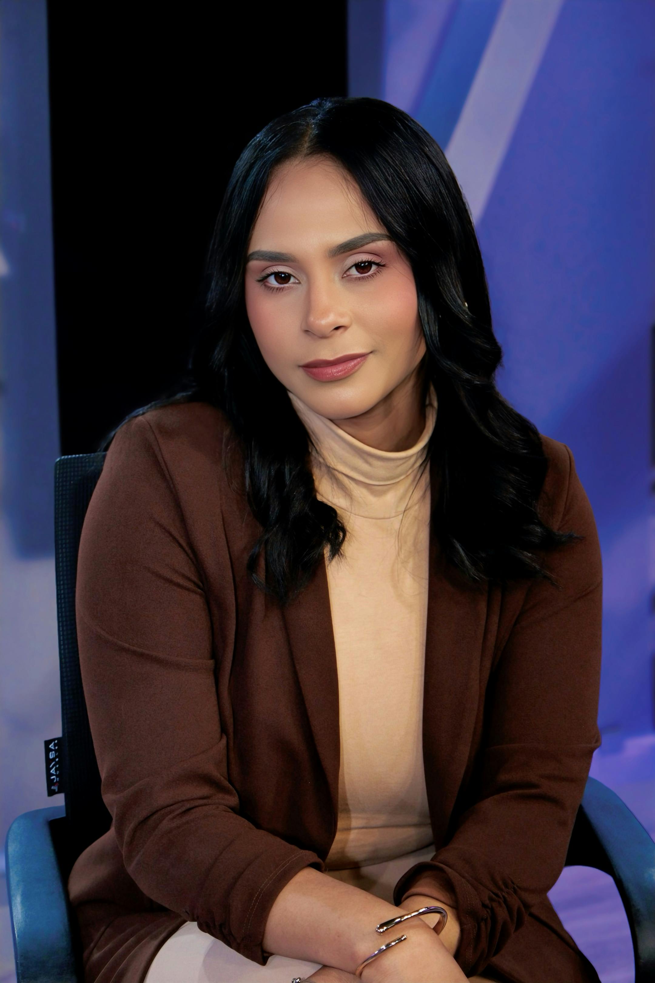 Confident woman in a business setting, radiating professionalism and poise.