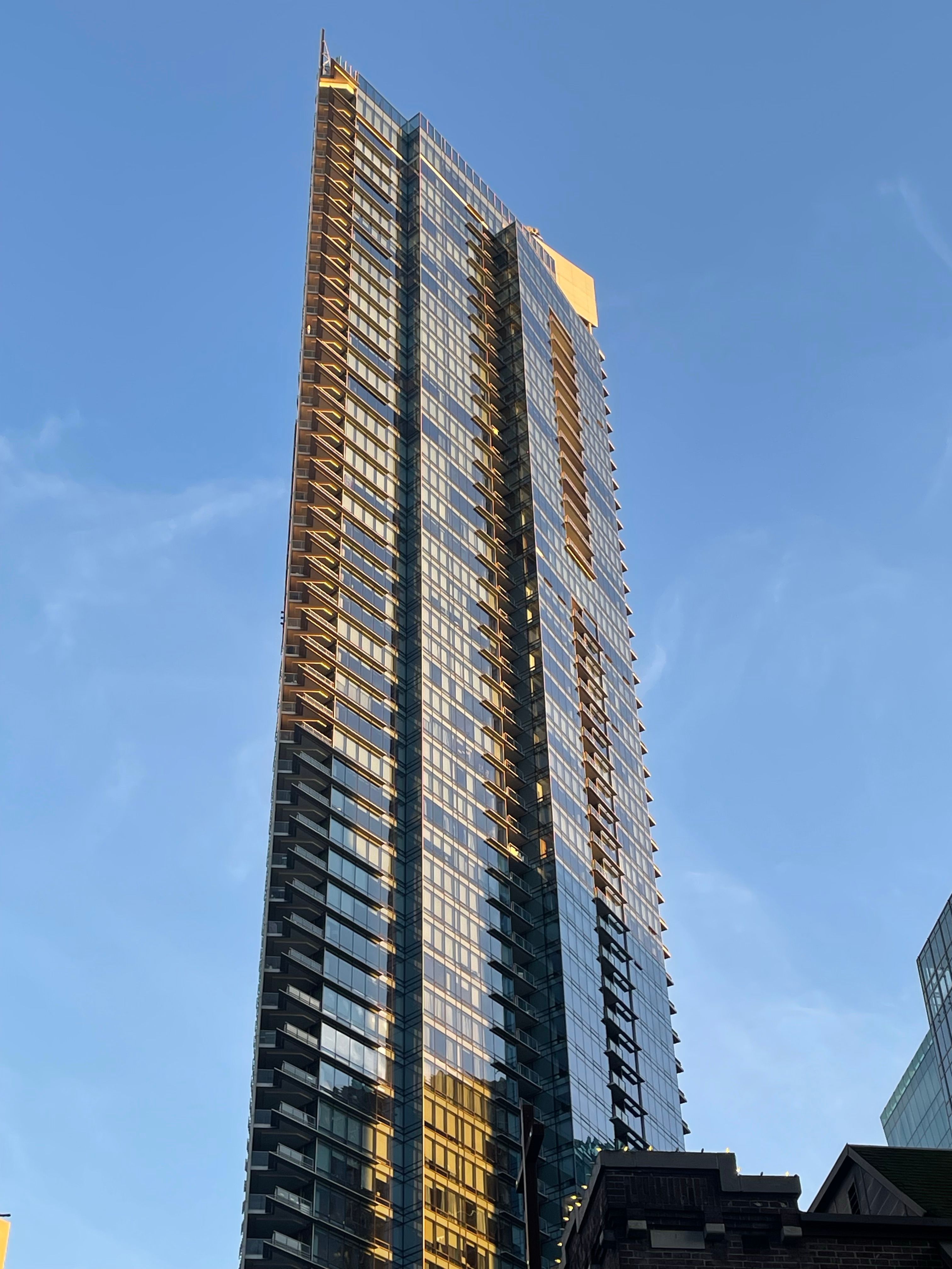 Modern Skyscraper Under Clear Blue Sky · Free Stock Photo