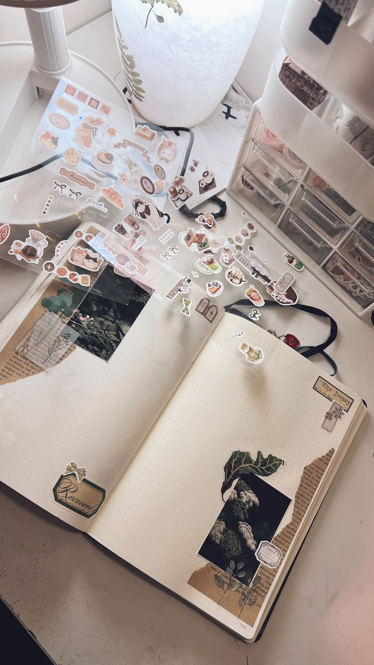 Creative journal with stickers and scrapbooking materials on a desk