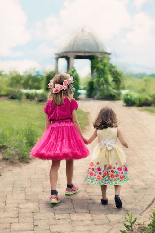 This image has an empty alt attribute; its file name is little-girls-walking-summer-outdoors-pretty.jpg