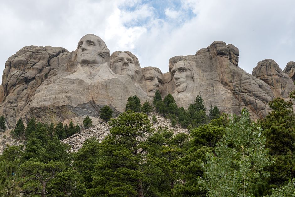 Explore the iconic Mount Rushmore with its monumental sculptures of four American presidents.