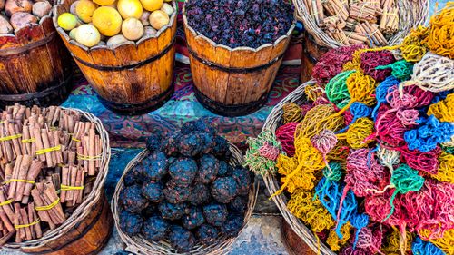 Free Colorful spices and herbs in baskets at a traditional market. Warm, inviting, and vibrant. Stock Photo
