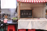 Street Food Stall with Chalkboard Menu in China