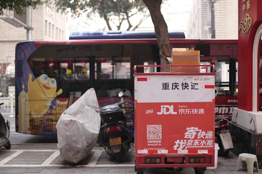 A JD Express delivery scooter parked in a bustling Asian city street.