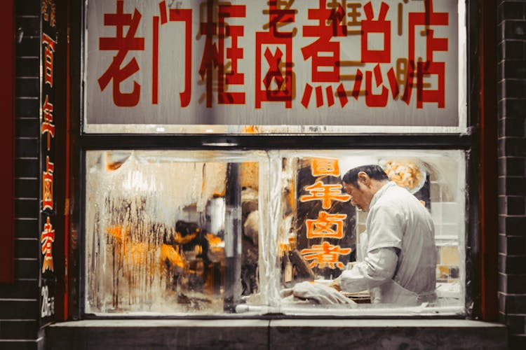 Man Working Inside The Kitchen