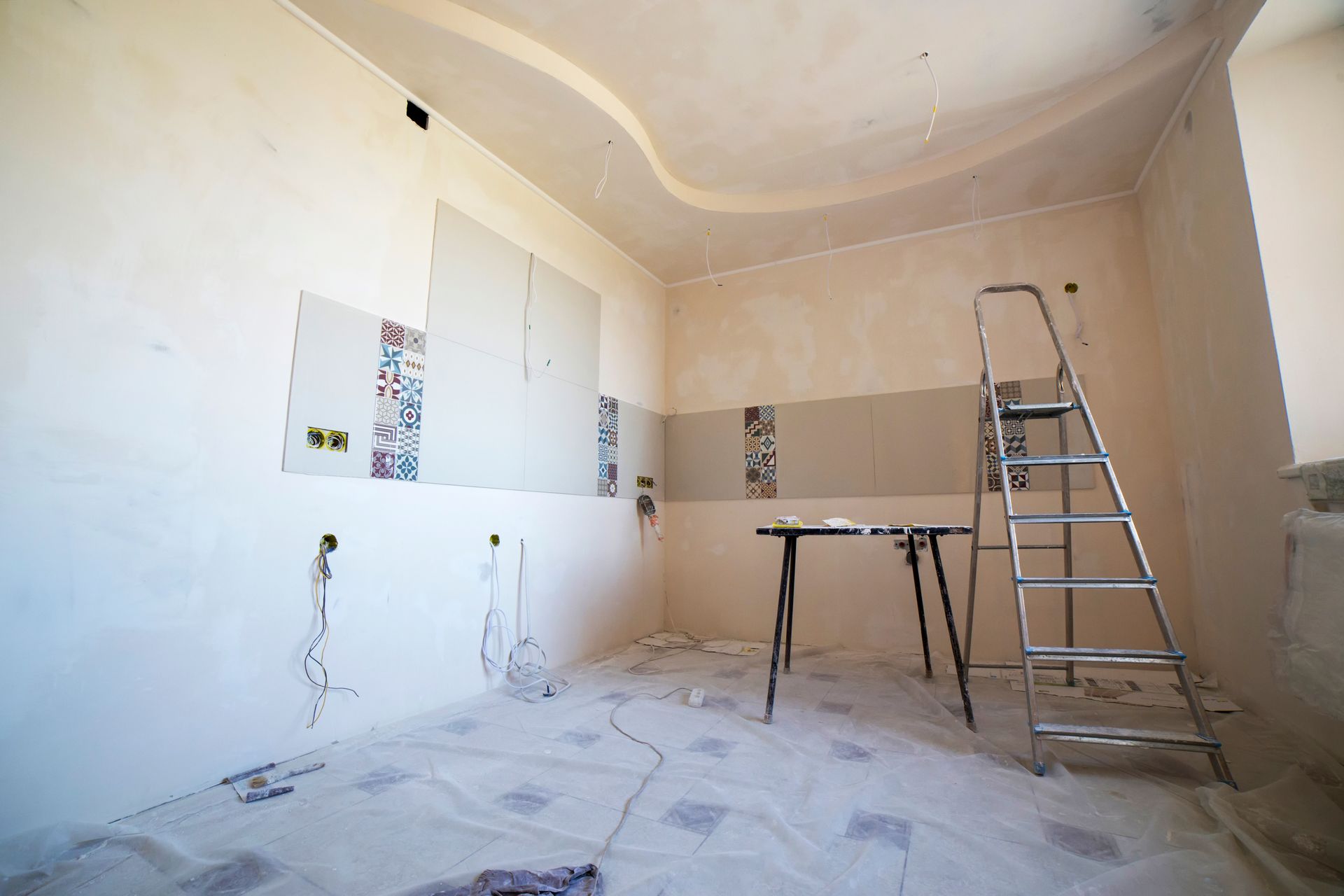 Interior room mid-renovation with tools and materials in place