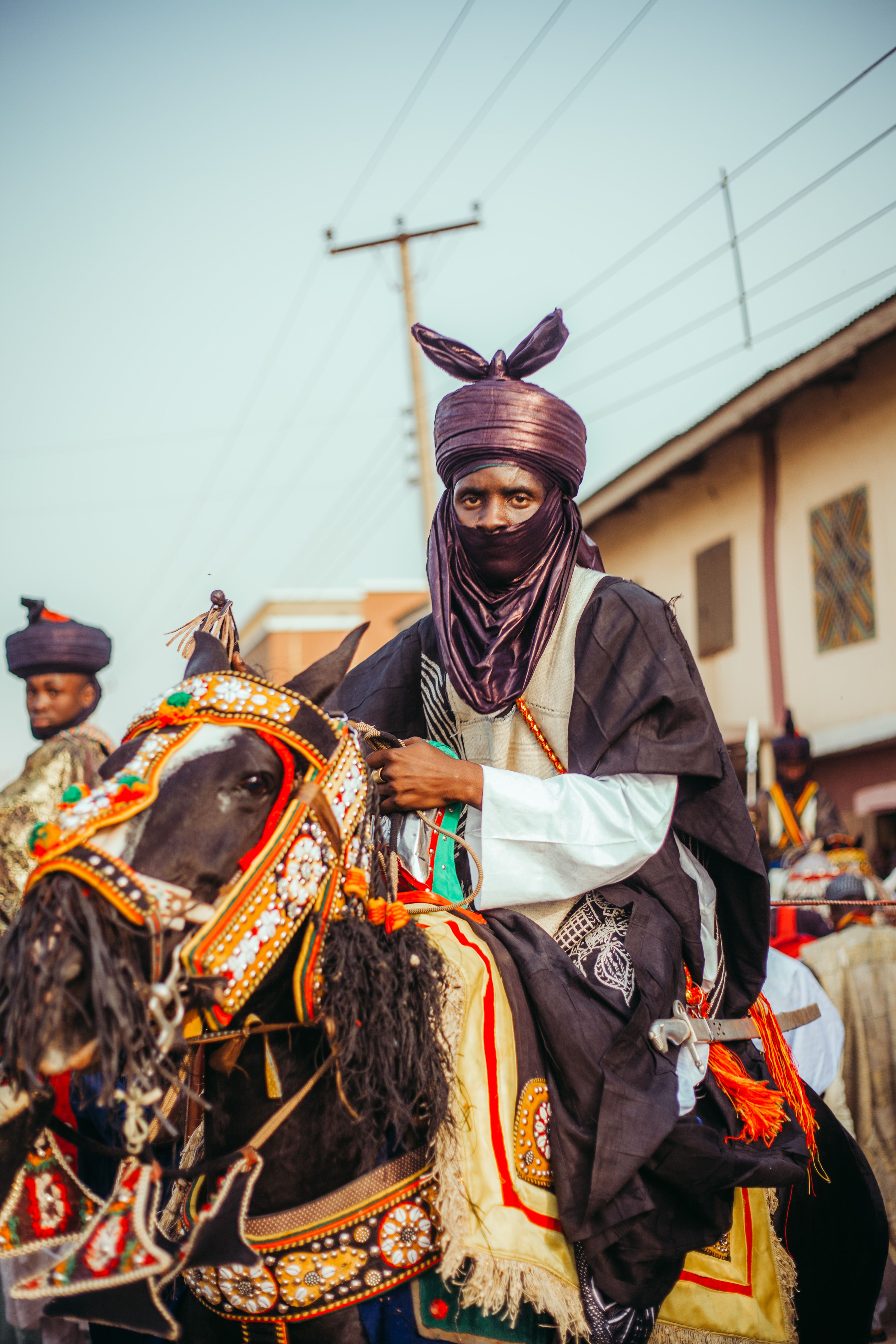 Man in Traditional Dress Riding Decorated Horse · Free Stock Photo